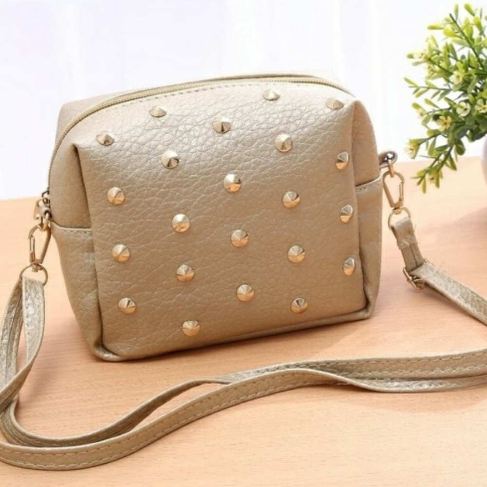 Golden studded cross body purse.